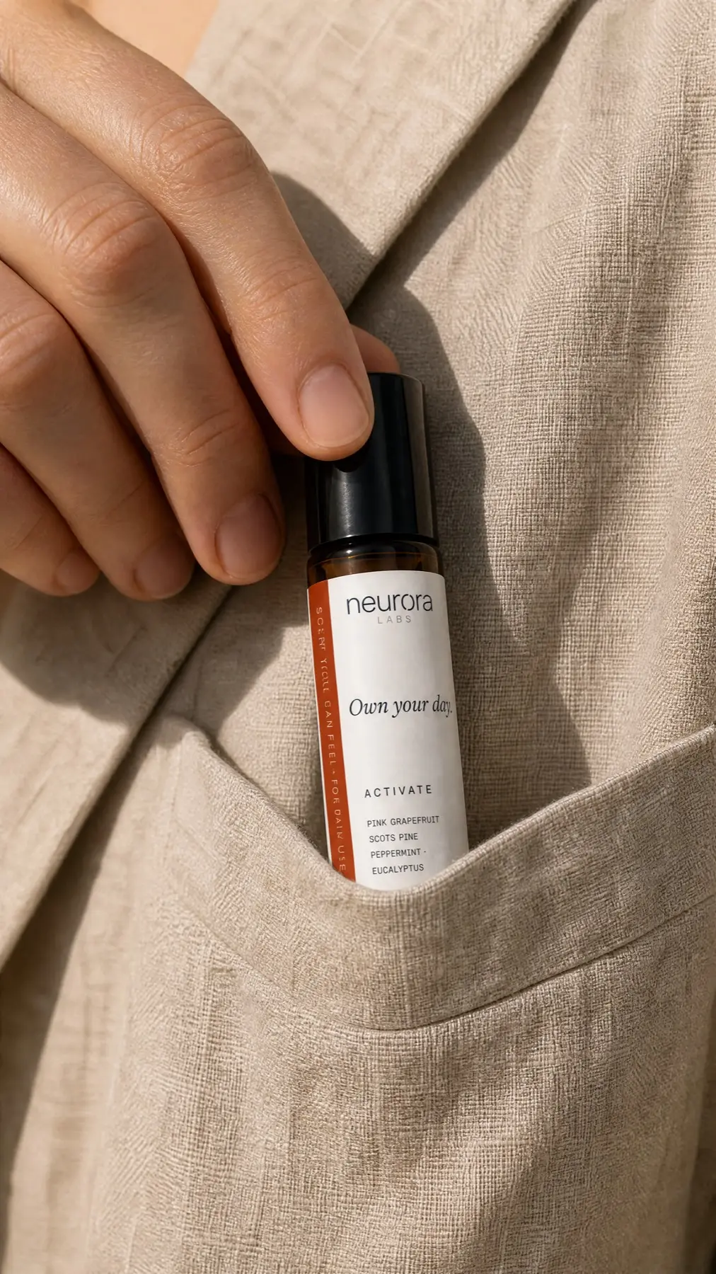 Neurora Activate Roll-On in a jacket pocket, pack-accurate label facing the lens