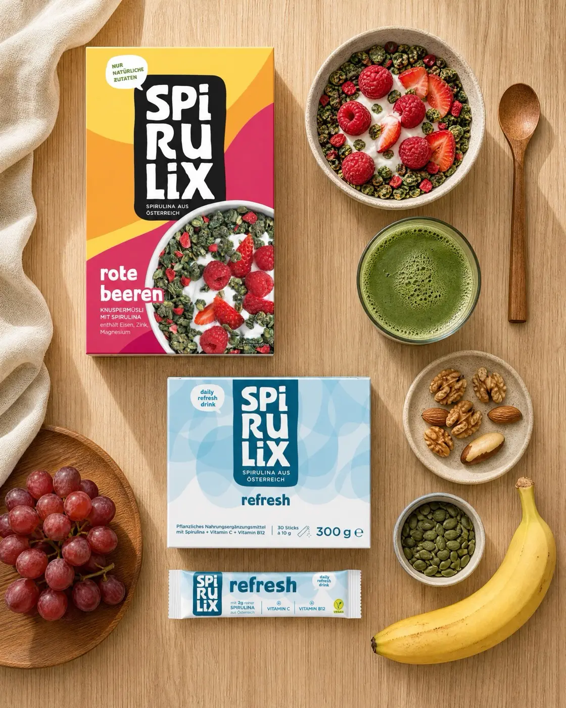 Top-down SPIRULIX breakfast flat lay with Rote Beeren, Refresh, fruit and a green drink