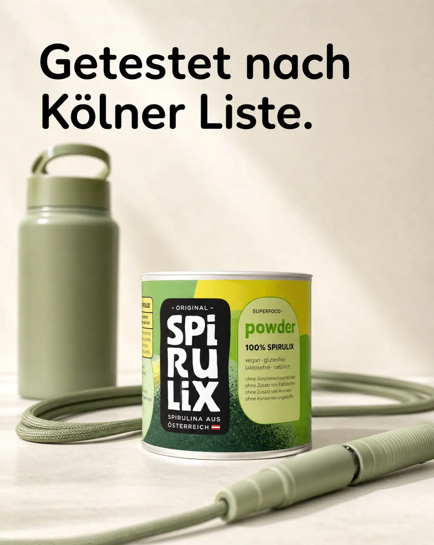 SPIRULIX Powder tin beside a skip rope and bottle in a clean sport still