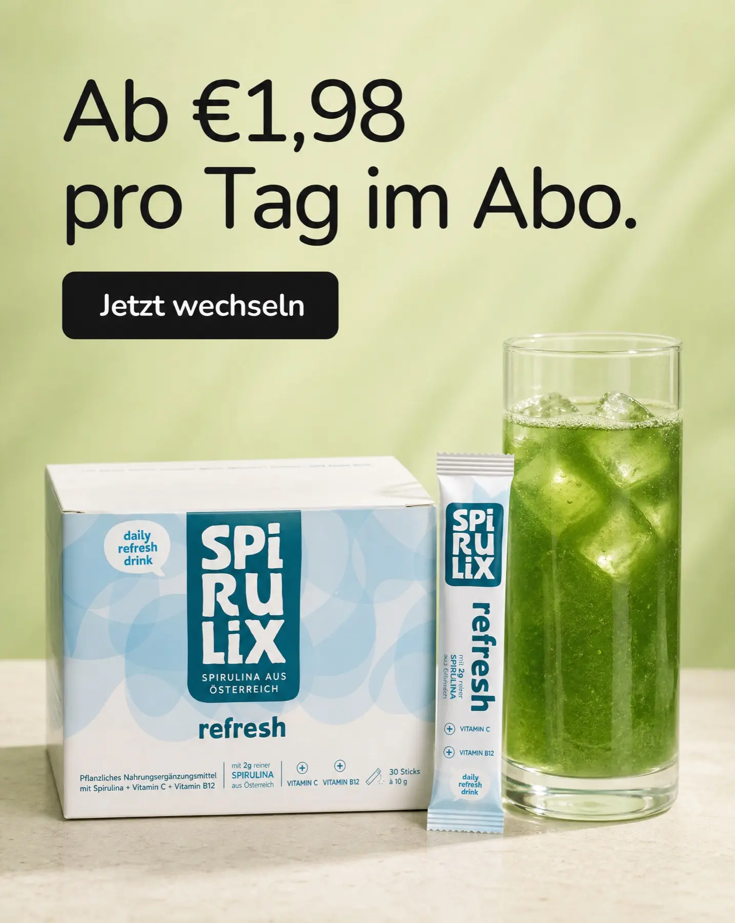 SPIRULIX Refresh box, stick and iced green drink on a pale studio surface